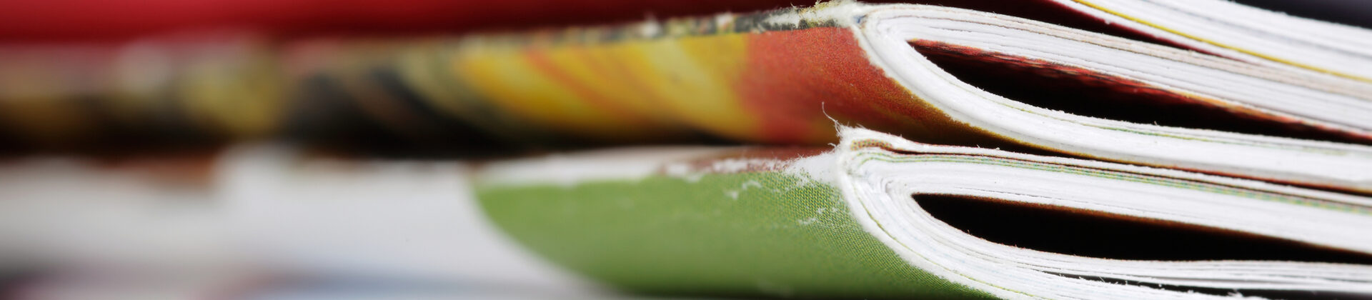 Close-up photograph of a stack of magazines