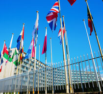 world flags in front of UNESCO headquarters in Paris, France
