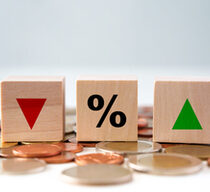 Interest rate finance and mortgage rates concept. Financial and banking, Interest rate, Deflation, Inflation, sale price and tax rise.  Wooden blocks with percentage sign and arrow up and arrow down.